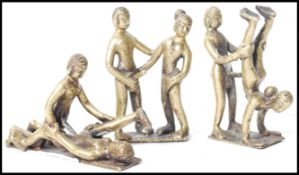 A group of three vintage 20th century Indian Kamasutra cast brass figurines of couples in various