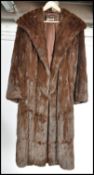 A vintage mid 20th century ladies dark mink coat, retailed by Harrods The three quarter length