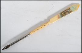 A 19th century Victorian Stanhope ivory pen and letter opener with painted pictorial and notation of
