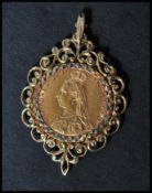 A 19th century Victorian sovereign pendant with Queen Victoria facing left set to a hallmarked 9ct
