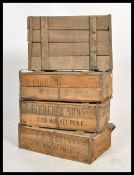 A stack of four vintage 20th century wooden fish shipping crates, notation to the sides and tops