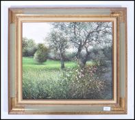 Jean-Claude Cubaynes - An accomplished framed oil on canvas picture, of a orchard meadow scene