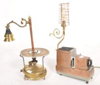 A mid century vintage Argus 300 projector lamp being upcycled into a table lamp together with