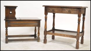 A 20th century Jacobean revival side / occasional table together with a similar style telephone