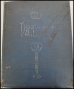 An early 20th century Edwardian postcard album with contents, approximately 170 postcards within