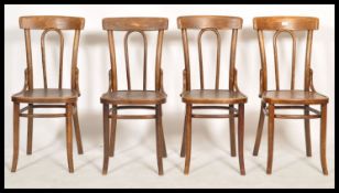 A set of four bent wood dining / bistro / cafe chairs in the manner of Thonet, railed backs