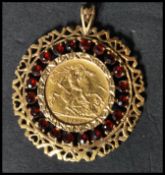 An early 20th century George V 1912 half sovereign gold pendant. The sovereign set to a fantastic