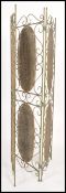 A 20th century cast and wrought metal rattan weave ladies discretionary folding screen. Green