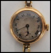 A hallmarked 18ct gold vintage 20th century cocktail watch set to an 18ct gold stamped expanding