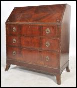 A Georgian style mahogany inlaid bureau being rais