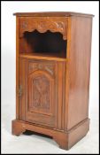 An Edwardian mahogany pedestal pot cupboard raised