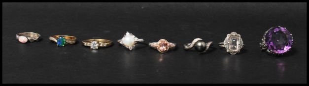 A collection of eight vintage silver jewellery rings to include gilt, opal, marcasite, clear