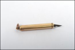 An early 20th century yellow metal tests as 9ct gold propelling pencil and pen compendium with