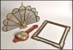 A 20th century peacock folding brass firescreen with finial top together with a Shortland banjo