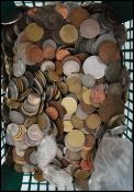A large collection of 20th century coins collected from around the world, coins from Germany, Spain,