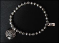 A hallmarked 925 silver designer expanding Chlobo bead bracelet strung with a heart pendant having
