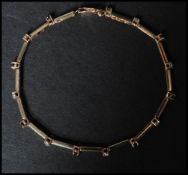 A hallmarked 9ct gold sapphire and diamond bracelet. The bracelet being set with 8 sapphires and 7