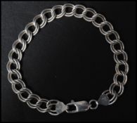 A hallmarked Italian 925 silver double chain link bracelet with lobster claw clasp. Measures 8