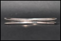 A 925 silver bangle bracelet with split design. Marked 925. Weight 24g.