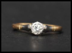 An 18ct gold and diamond solitaire ring. Marked 750, tests 18ct gold. Diamond approx 15 points.