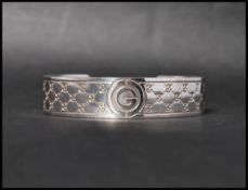A hallmarked 925 silver designer Gucci cuff bangle bracelet . Marked Star  6971 AR 925 R Gucci