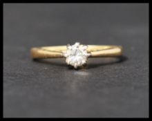 A hallmarked 18ct gold diamond solitaire ring. Diamond approx 25 points. Hallmarked London. Weight