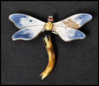 A hallmarked silver and guilloche enamel brooch pin in the form of a dragonfly. Hallmarked