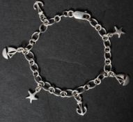 A hallmarked 925 silver charm chain bracelet having starfish and sailing boat charms with a