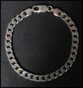 A hallmarked 925 silver curb chain bracelet with lobster claw clasp. Measures 8 inches. Weight 17g
