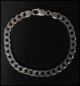 A hallmarked 925 silver curb chain bracelet with lobster claw clasp. Measures 8 inches. Weight 17g