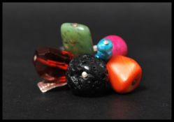 A designer silver and coral bead ring by Riley Burnett decorated with coral and semi precious beads.