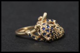 A hallmarked 9ct gold and sapphire ring in the form of a panther. Hallmarked Birmingham. Size T.