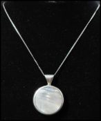 A hallmarked 925 silver pendant necklace strung with a double sided pendant. Pendant hallmarked