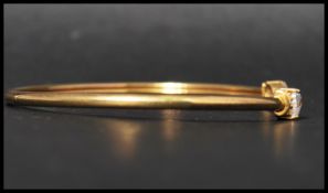 A 925 silver gilt and CZ cuff bangle bracelet having heart cut CZ finials. Marked 925 CZ GPS. Weight