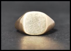 A hallmarked 9ct gold signet ring. Hallmarked Birmingham. Weight 6.9g. Size R.
