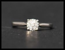 A hallmarked 9ct gold and diamond ring having 7 illusion set diamonds. Hallmarked Sheffield.