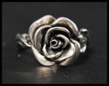 A 925 silver ring in the form of a flower. marked 925. Size O.