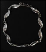 A hallmarked 925 silver fancy link bracelet with lobster claw clasp. Measures 7.5 inches. Weight 9g