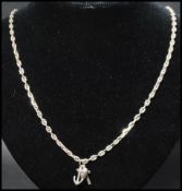 A hallmarked 925 marine chain pendant necklace strung with Faith Hope Charity pendant charms.