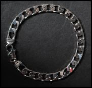 A 9ct white gold Italian curb link bracelet with lobster claw clasp. Marked A1 Star 375. Measures