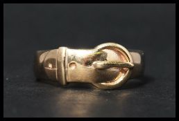 A hallmarked 9ct gold buckle band ring. Hallmarked Birmingham. Weight 4.8g. Size S.5.