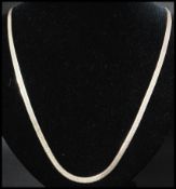 An Italian 925 silver flat chain necklace having a lobster claw clasp. Measures 22 inches. Weight