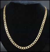 A hallmarked 9ct gold flat curb link chain necklace having a lobster claw clasp. Hallmarked