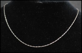 An 18ct white gold fancy link chain having a lobster claw clasp. Marked 750 Italy AJD. Measures 16