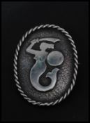 A vintage hallmarked silver brooch pin with figural mermaid motif with roller clip clasp and rope