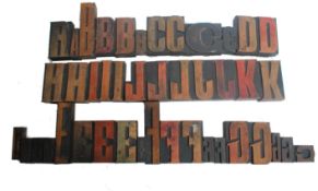 A large collection of good sized printers block advertising letters mounted on wooden blocks various