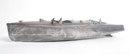 A vintage early 20th century Art Deco model of a speed boat. The polished steel body having detailed