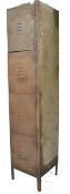 A vintage mid century Industrial upright pedestal locker having a series of 4 drawers running