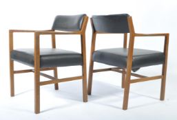 A pair of vintage mid 20th century Alfred Cox board room Air Ministry armchairs, black upholstered
