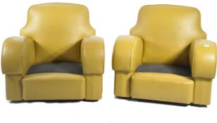 A pair of stunning 1930's Art Deco club armchairs. The chairs with stunning shaped armrests and club